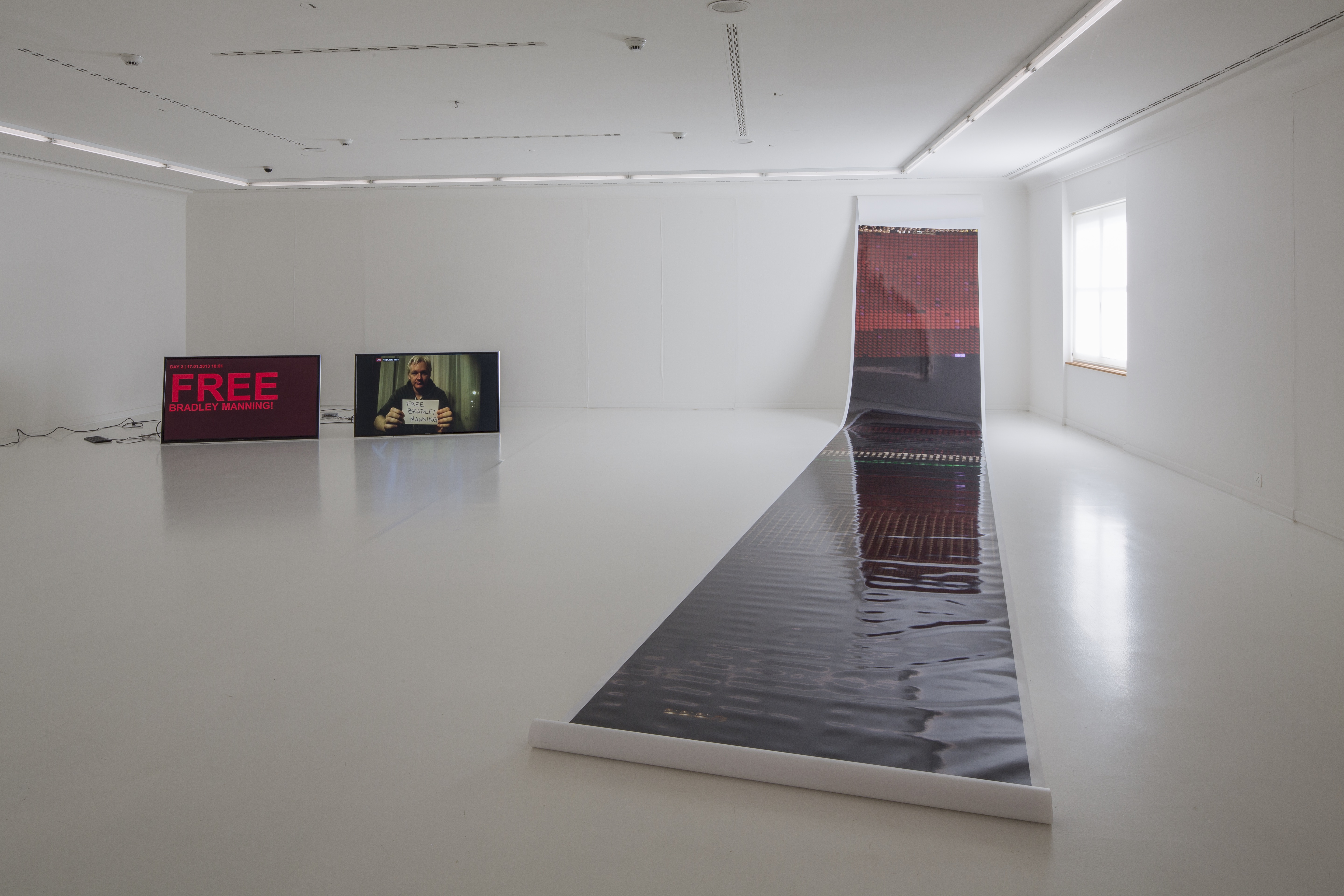 !Mediengruppe Bitnik, Delivery for Mr. Assange, exhibition view, Helmhaus Zurich, 2014 Photo: FBM Studio / courtesy Helmhaus Zurich